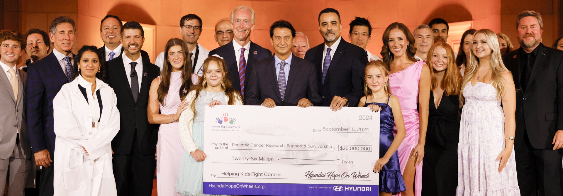 helping kids fight cancer foundation showing their big check from hyundai hope on wheels - Visalia Hyundai in Visalia CA